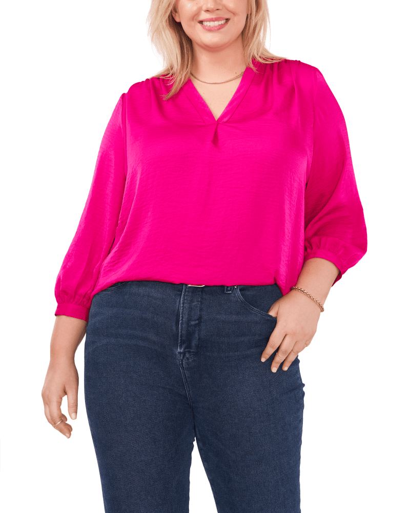 Front of a model wearing a size 1X Everley V-Neck Blouse in WILD PETUNIA by Vince Camuto. | dia_product_style_image_id:261631